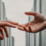The two people reached out to each other and touched each other