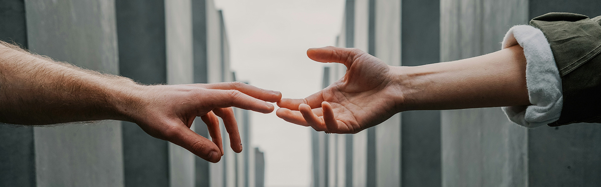 The two people reached out to each other and touched each other